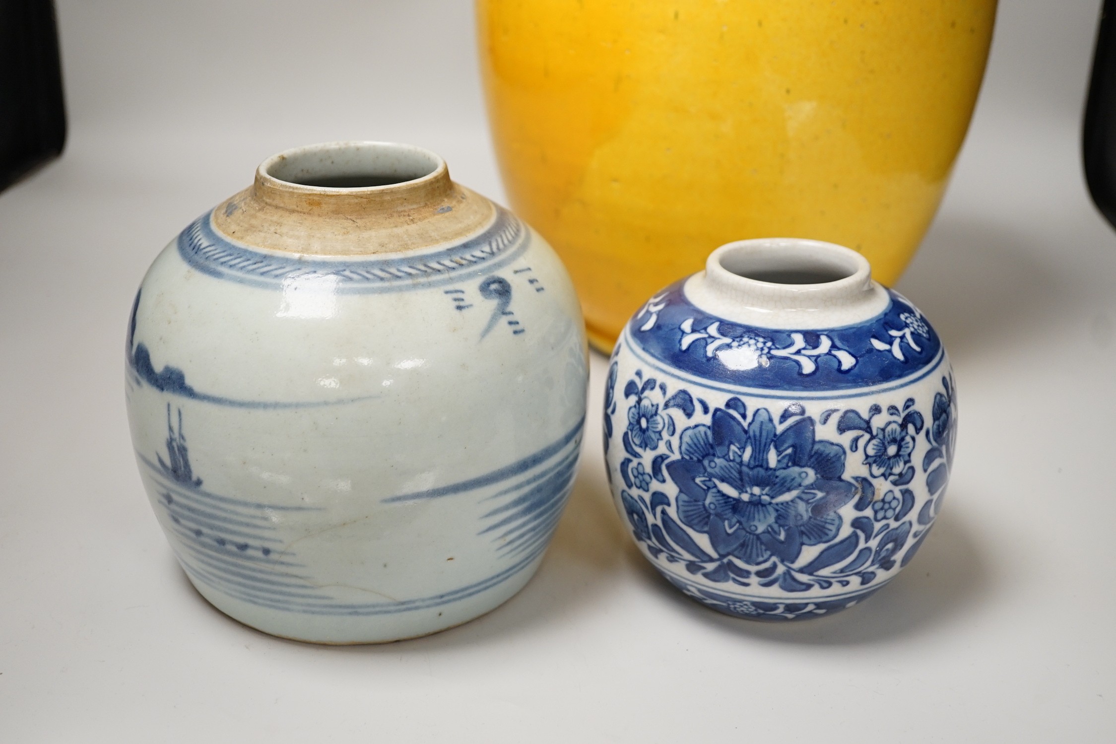 Two Chinese blue and white ginger jars, together with a large Chinese yellow glazed vase, tallest 31cm